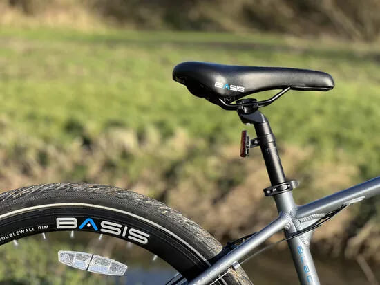 Basis electric bike with pedal assist, perfect for commuting, off-road cycling, and city travel across the UK.