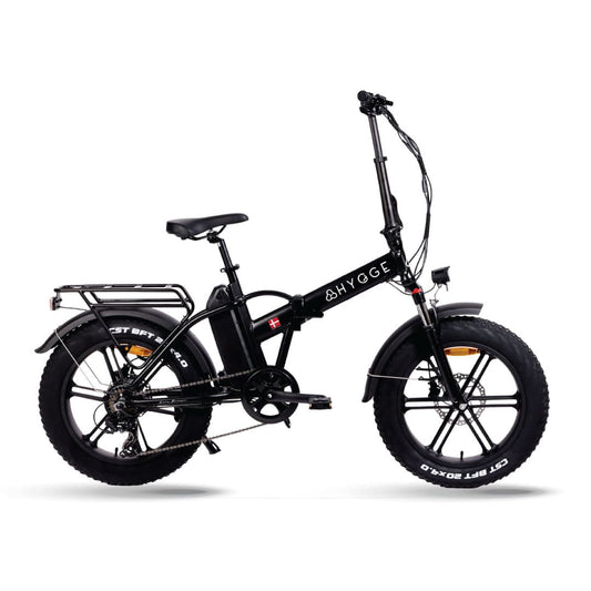 Folding fat tire electric bike with pedal assist, perfect for city ommuting and everyday travel across the UK.