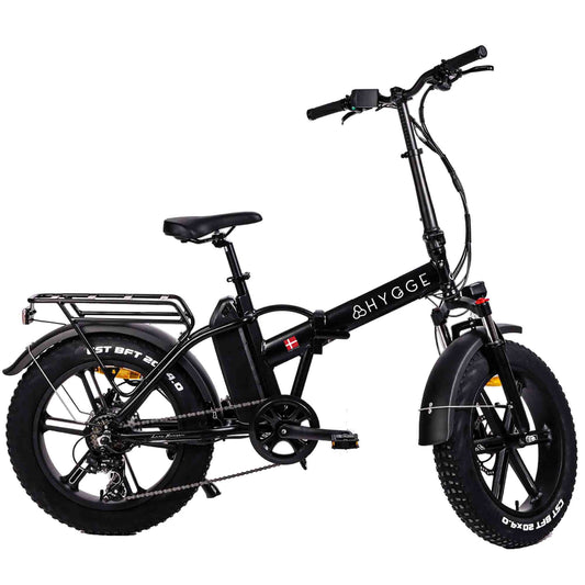 Folding fat tire electric bike with pedal assist, perfect for city ommuting and everyday travel across the UK.