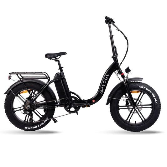 Folding step through electric bike with pedal assist, perfect for city ommuting and everyday travel across the UK.