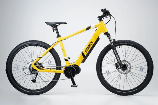 Yellow electric bike with pedal assist, perfect for commuting, off-road cycling, and city travel across the UK.